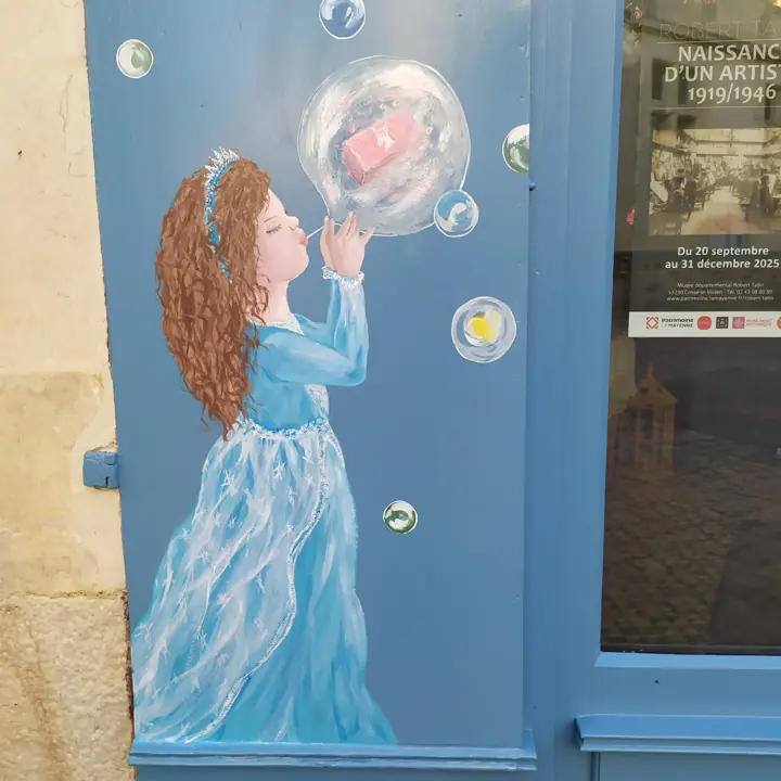 Décor et lettrage peints sur la vitrine d'un commerce, étape 9
